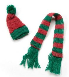 two knitted hats and scarfs on a white background, one with green and red stripes