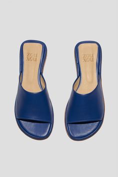 Get ready for the Pileta Slide in Cobalt to be your favorite summer shoe. It's got the ease of a flip-flop but is as finely crafted as any shoe in our collection, which means it's going to be a keeper. Its simple shape and stand-out color will make it easy to combine with a range of textures, fabrications and silhouettes in your summer wardrobe. Who it's for: The woman who loves a pop of color. Kidskin upper with vegetable tanned leather lining and a 25 mm stacked leather heel and sole. Handmade in Argentina. Loafer Mules, Flat Boots, Heeled Loafers, Simple Shapes, Boot Sandals, Vegetable Tanned Leather, Cobalt, Slides, Summer Shoes