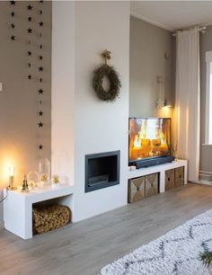 a living room filled with furniture and a flat screen tv on top of a fireplace