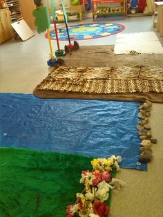 the room is decorated with flowers and rocks