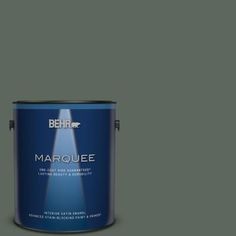 the behr marquee paint is shown in an open, gray - toned color