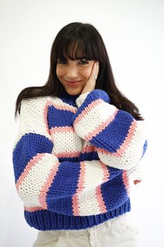 Our Zora Sweater is a soft chunky knit piece, intentionally designed as a luxury staple. The hand-knitted material and braided neckline is perfect for layering or by itself. Oversized, relaxed Royal blue, baby pink, and white vertical stripe detail Hand knitted Balloon sleeves with cinched wrists Royal blue braided neckline and bottom trim 100% Acrylic Your order will ship from our warehouse in Florida, USA! Cozy Blue Chunky Knit Pattern, Trendy Hand Knitted Pink Sweater, Casual Pink Chunky Knit Pattern, Casual Chunky Knit Pink Knitting Pattern, Oversized Hand-knitted Pink Sweater, Cozy Pink Knit Knitting Pattern, Cozy Pink Knitting Pattern, Pink Hand Knitted Knitting Pattern, Knitted Swatches