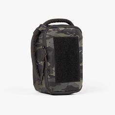 a black and grey camo bag with a small pocket on the front, it is open