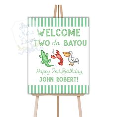 an easel with a sign that says welcome two da bayou happy 2nd birthday john roberts