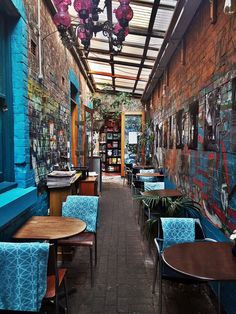 the inside of a restaurant with tables and chairs