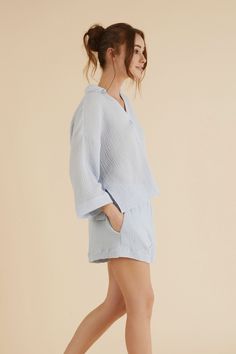 Effortless Echo Boy Short Baby Blue is an ideal style for brunch dates or a coffee break. Designed with a breeze from 70’s, will be a timeless piece in your wardrobe that withstands trends for supporting slow fashion. Made with sustainability in mind, this short features breathable fibers. This high elastic waisted short is slightly oversized with side pockets, allowing you to move freely throughout the day. - 100% Turkish cotton- Side pockets Comfortable Blue Sleepwear For Spring, Blue Collared Relaxed Fit Sleepwear, Spring Solid Color Relaxed Fit Sleepwear, Solid Spring Sleepwear With Relaxed Fit, Light Blue Relaxed Fit Sleepwear For Summer, Chic Blue Sleepwear For Loungewear, Relaxed Blue Tops For Daywear, Effortless Blue Tops For Spring, Comfortable Summer Tops For Daywear