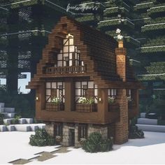 a small wooden house sitting in the middle of a forest