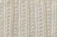 the texture of a white knitted fabric is shown in close - up, as well as horizontal stripes