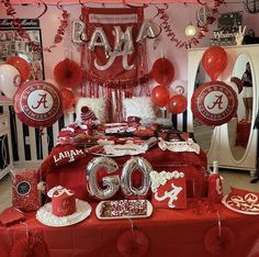 a red table with balloons and decorations for a 60th birthday party at home or office