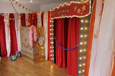 a circus stage with red curtains and lights