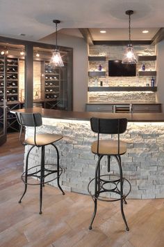 two stools sit at the bar in this modern home