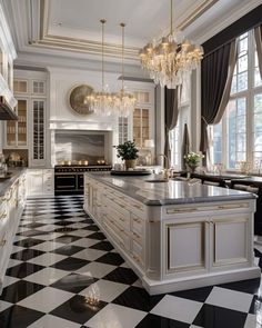 an elegant kitchen with black and white checkered flooring, chandeliers and cabinets