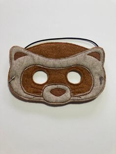 a felt mask with a cat's face on it