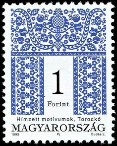 a stamp with the number one on it and an image of a blue flowered border