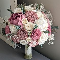 Please Read Entire Description Before Purchase Bouquet with sola wood flowers in pinkish mauve, dusty rose, and ivory, with baby's breath and faux greenery. Flower styles can and will vary based on current inventory levels and to keep orders unique, so they are not exact duplicates. Please include your choice of stem wrap and color (color of ribbon, white or ivory lace, or twine) in the notes section. Size pictured is an extra large (approximately 10" in diameter). Size shown in video is a mediu Ivory Bouquet, Wood Flower Bouquet, Ribbon White, Dusty Rose Wedding, Faux Greenery, Bouquet Toss, Small Bouquet, Wood Flowers, Baby's Breath