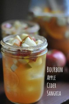 bourbon apple cider sangria in a mason jar with sliced apples on the side