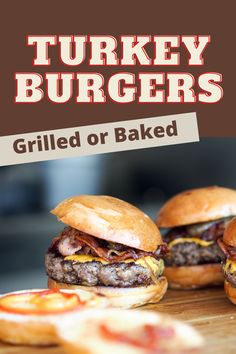 three burgers sitting on top of a cutting board with the words turkey burgers grilled or baked