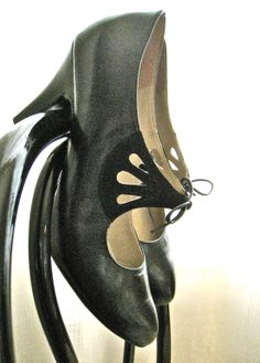 a pair of shoes that are sitting on a stand