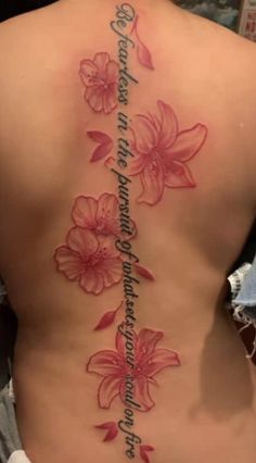 a woman's back with pink flowers on it and the words, i love you to