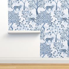 a wallpaper with blue trees and animals on it