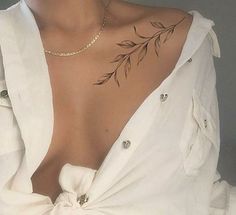 a woman with a tattoo on her chest