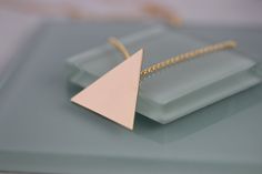 "Inspired by Stevie Nicks, I created this Triangle Pendant Necklace. This is an equilateral triangle with 1 1/8\" sides. The bale is attached on the back for a smooth seamless effect. Choose from 14k gold filled or solid sterling silver. I am pairing this pendant with a sturdy rolo style gold filled chain in a variety of lengths to suit your needs. Wear alone as a statement or layer with other necklaces. Please leave a note in the message to seller upon checkout to indicate if you want shiny or Minimalist Triangle Jewelry For Formal Occasions, Stevie Nicks Moon Necklace, Elegant Triangle Yellow Gold Necklace, Nickel-free Bohemian Triangle Jewelry, Silver Triangle Metal Necklace, Nickel-free Triangle Sterling Silver Jewelry, Stevie Nicks Style, Triangle Necklace, Triangle Pendant