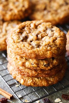 three cookies stacked on top of each other with cranberries and cinnamon sticks next to them