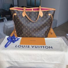 This Stunning, Like-New, Authentic Louis Vuitton Neverfull Mm (Medium Size) Handbag With Pink Interior Is One Of The Most Sought After Handbags Out There! This Handbag Has A Beautiful Patina To The Leather Trim, No Rips Or Stains On The Canvas, No Tears Or Marks On The Inside Except For A Very Light White Spot On The Inside Which Is Shown In The Pictures, But Is Hidden By The Matching Pink Organizer That Comes With The Purse. Included Is The Dust Bag, Original Box, Matching Pink Organizer And Blue Gift Bow. No Lowball Offers And No Transactions Off Of Poshmark. Reasonable Offers Will Be Considered. Scammers Will Be Ignored. No Messages Will Be Sent To Emails Or Phone Numbers. Pink Organizer, Pink Louis Vuitton, Gift Bow, Louis Vuitton Pink, Louis Vuitton Neverfull Mm, Neverfull Mm, Pink Interior, Gift Bows, Blue Gift