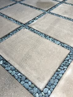 a stone walkway with stones and gravel on it