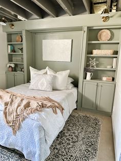 a bed sitting in a bedroom next to a book shelf