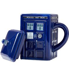 a blue coffee mug with the doctor who logo on it