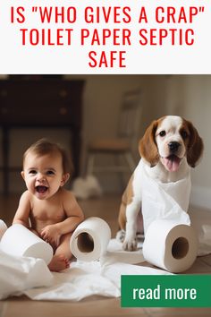 a baby sitting on the floor next to two dogs with toilet paper