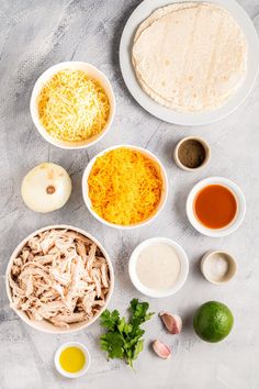 ingredients to make chicken tortillas laid out on a table