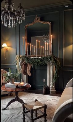 a living room filled with furniture and a fire place covered in christmas greenery next to a fireplace