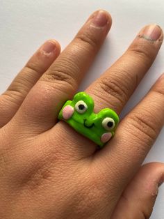 Frankly Froggie Ring is made out of polymer clay, and is sealed. Made for around a US size 8, but can fit similar sizes. Ready for all the frog vibes! Clay Ring, The Frog, May 20, Rye, Rings Statement, Making Out, Statement Rings, Polymer Clay, Jewelry Rings