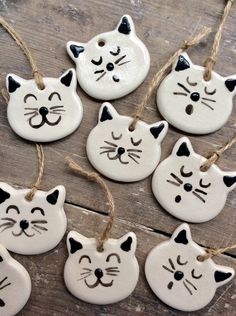 white ceramic ornaments with black cats on them