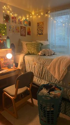 a bed room with a neatly made bed and lots of lights on the wall above it