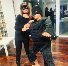 two people dressed up as batman and catwoman