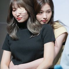 two young women with their arms around each other