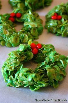 christmas wreath cookies with green icing and red berries