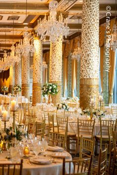 the tables are set up with candles and centerpieces for an elegant wedding reception