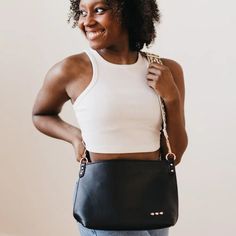 Make a statement with the Cora Structured Hobo Bag! This structured hobo-style bag features a guitar strap and snap closure for easy access, plus two handy zippers (one on the outside, one on the inside) for extra security. It also includes a small cloth pocket inside, so you can keep your goodies safe and organized. And with its flexible body, you can dress it up or down for any occasion! Flexible Body, Curvy Girl Dress, Hobo Style, Graphic Tops, Guitar Strap, Top Sales, Men's Collection, Hobo Bag, Easy Access