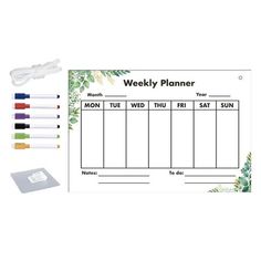 the weekly planner with markers and pens is shown in front of an assortment of stationery items