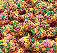 there are many balls of candy in the middle of this photo, and it looks like they have been made out of gummy's