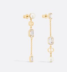 The Petit CD earrings offer an elegant and streamlined style. The asymmetric pair features a finely-worked gold-finish metal chain with white resin pearls and silver-tone crystals, elevated by the CD signature. The modern, refined earrings can be worn with other Petit CD creations..