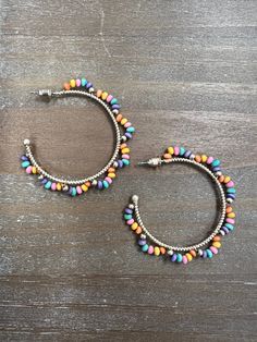 Multicolored wood bead hoop earrings. 40MM Multicolor Wooden Beads Round Earrings, Multicolor Wooden Beaded Round Earrings, Multicolor Wooden Beaded Earrings, Multicolor Small Hoop Jewelry With Dangling Beads, Multicolor Wooden Beads Dangle Earrings, Multicolor Dangle Beaded Earrings With Wooden Beads, Multicolor Dangling Beads Hoop Earrings, Multicolor Dangle Jewelry With Wooden Beads, Nickel-free Multicolor Hoop Earrings