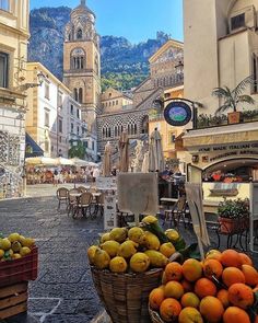 there are many fruits in baskets on the street