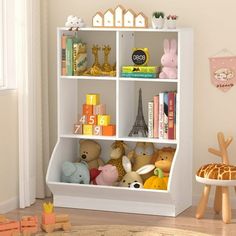 a white book shelf filled with lots of toys