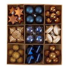 a box filled with lots of different types of christmas balls and ornaments on top of each other