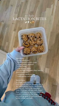 a person holding a plastic container filled with cookies